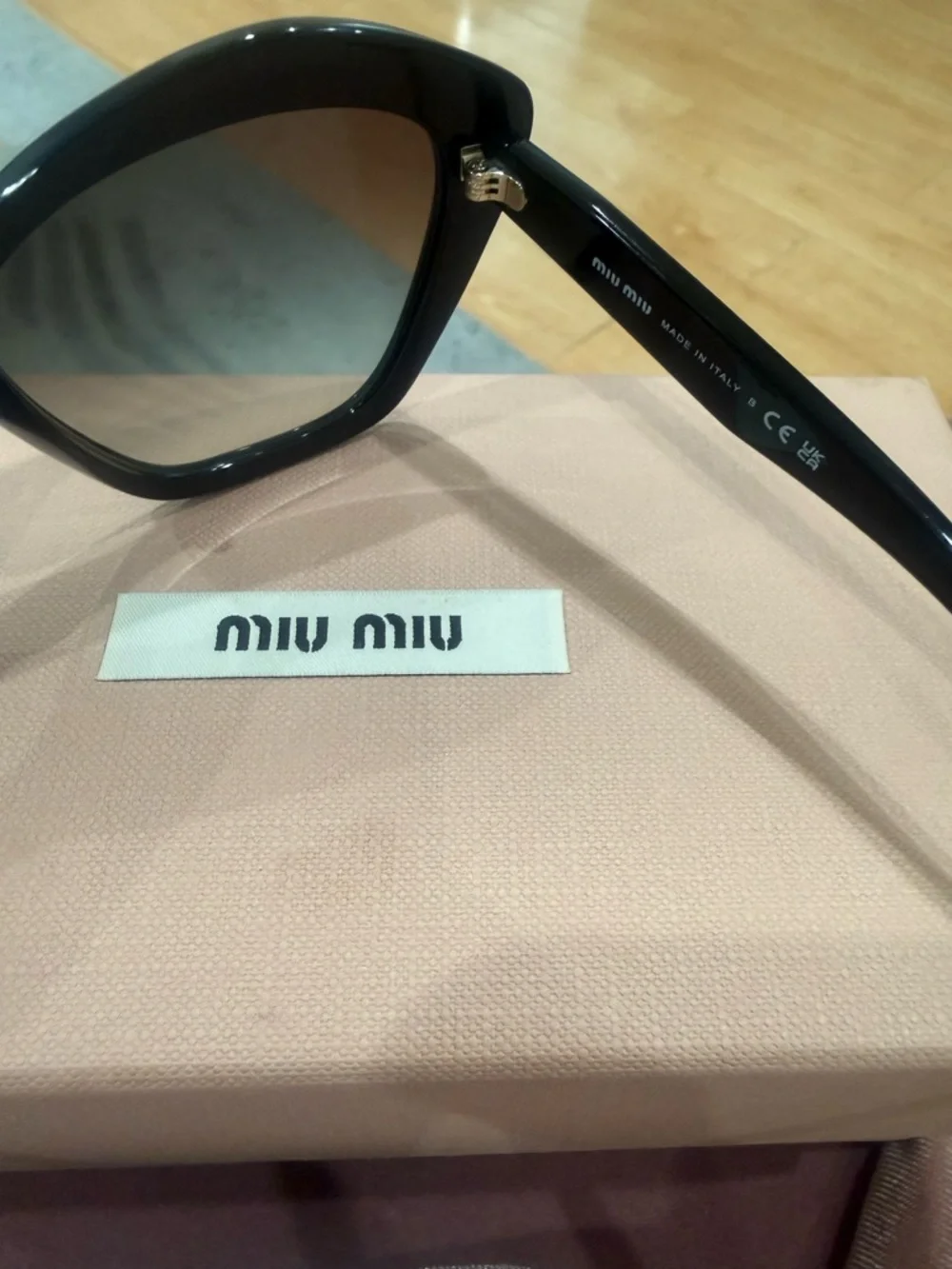 Miu Miu Black Cat-Eye Sunglasses with Dark Lenses